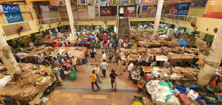 People throng markets to buy essentials