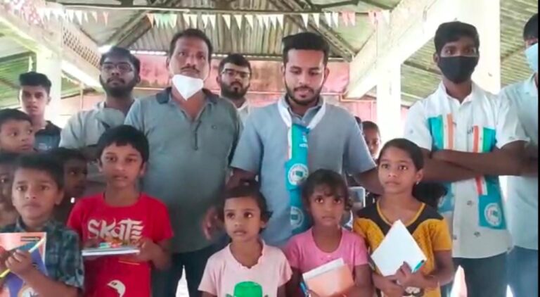 NSUI distributes books in Satre village, demands CM to resolve connectivity issues